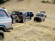 PA180019 - Brian's Zuk preparing for the 1st steep ascent.
It was semi-handicapped with 2wd.
No problem, we'll just pull ya up
