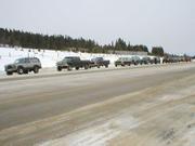 PC130021-Taking a rest on MacDonald pass, while several participants clean their windshields.
12 rigs are lined up, with Mike K