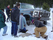 tyler fixing stubby\'s stub axle on trail.