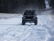 Mike H hauling butt across a hard packed drift.