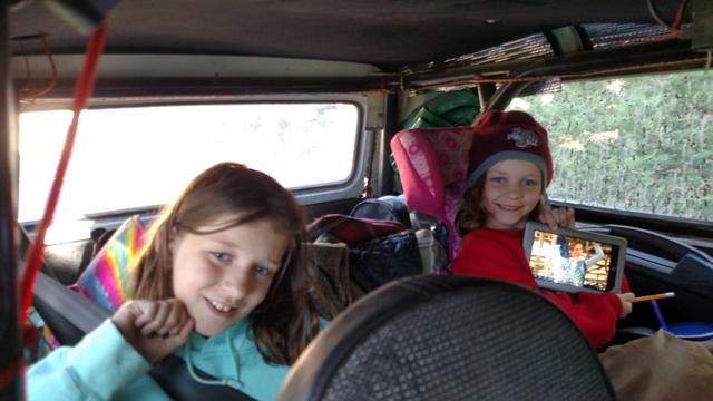Joleigh and Audrey Mandera take shelter from the cool wind