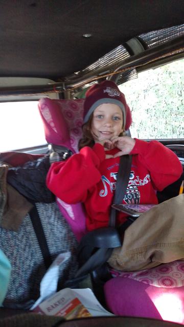 Audrey flashes a gang sign..