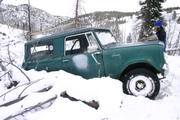 Stuck against a fallen tree, trying to go up a steep icy hill.