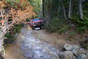 Don Gordon brings his Big Bronco up the trail.