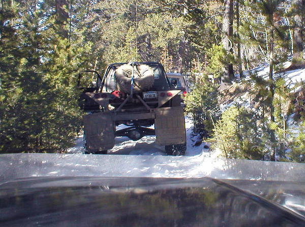 Finally! On the trail!
Doug and Janet Herold following the Hybrid, then Doug Misko's Bronco, a slew of others, with Mike Kelly 