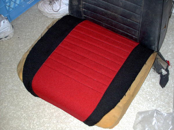 Side bolster covers stitched to center. The sides are black tweed.