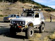 Samurai sittin on 34 inch swampers with beadlocks.