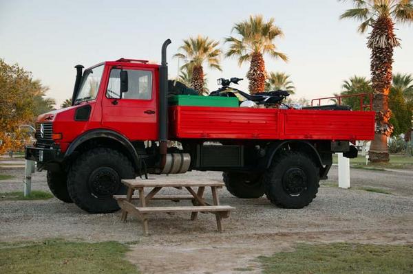 bed is 8' wide and 14' long, can carry a hummer in back