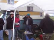 Mark Korsten, Leonard Nelson, and John Comer converse