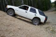 Ray tries to climb the gravel pile and gets hung up on his receiver hitch.  Oops.