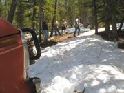 Winch time. Tyler Gordon drags the cable uphill.