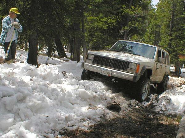 Davin Gordon throttles up the hill with Dad looking on.